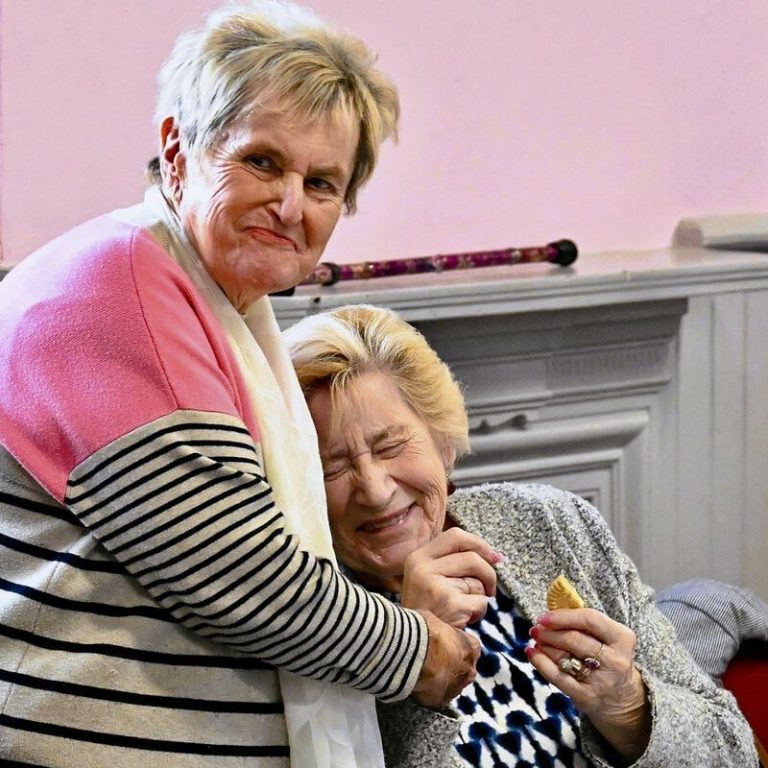 A volunteer interacts with a woman in a local stroke support group.